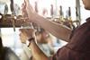 Close-up of bartender making cask beers at bar - stock photo