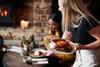 Waitress_serving_meal_GettyImages_1167590348