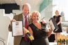 Peter Furness-Smith, managing director of McMullen's, presents Jenny White with her award
