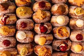 Close up of Bread Ahead doughnuts with a variety of toppings