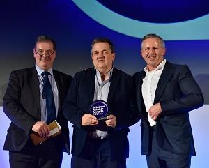 David Campbell collecting the Retailers Retailer of the Year award