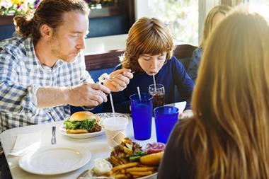 Family meal in restaurant GettyImages-1306019758