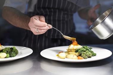 Chef plating up in restaurant