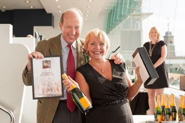 Peter Furness-Smith, managing director of McMullen's, presents Jenny White with her award