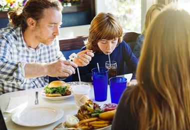 Family meal in restaurant GettyImages-1306019758