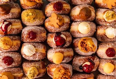 Close up of Bread Ahead doughnuts with a variety of toppings