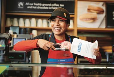Greggs - A worker serves a Sugar Strand Doughnut, another example of a 'quietly vegan' bakery product