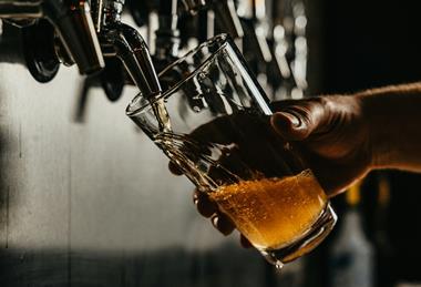 pint of beer pulling unsplash