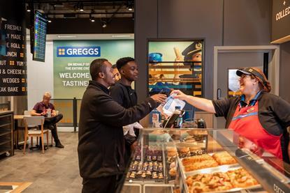 Two customers being served at the Greggs Gatwick store