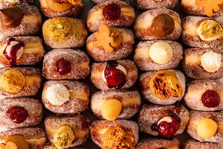 Close up of Bread Ahead doughnuts with a variety of toppings