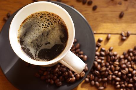 Coffee cup with coffee beans